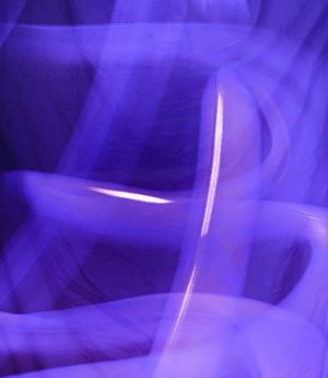 Abstract image of light trails representing movement flow.